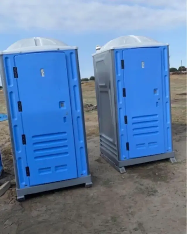 Construction porta potties on a dirt job site