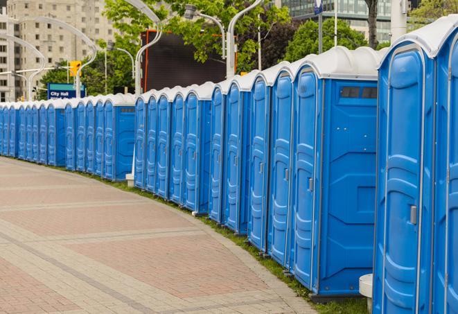 a row of portable restrooms at a fairground, offering visitors a clean and hassle-free experience in perkins